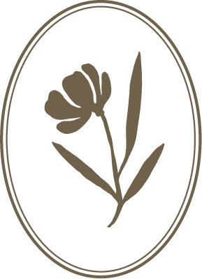 Decorative element with a stylized flower in an oval frame